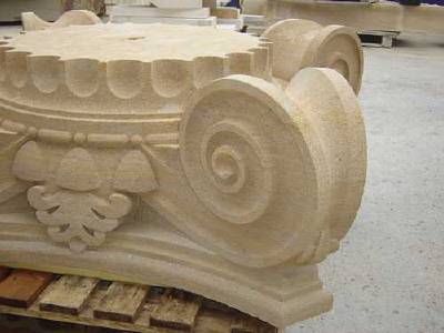 Machined stone capital