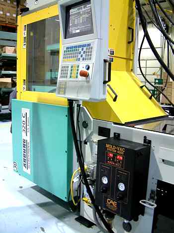Mold-VAC air and gas evacuation systems attached to injection molding machine