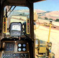 SiteVision GPS installation from the dozer cabin.  Note the GPS trasnsponder outside on the blade tip and vertical light bars either side of the display in the cab.