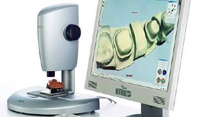 Constructing dental prostheses onscreen: Sirona CAD/CAM workstation with 3D scanner.