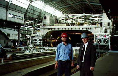 Mark Dewey, Incat shipyard liaison manager and John Ryan, VP Sales CADKEY, in the main construction shed at the Incat yard. The vessel under construction is a Revolution 120 class WPC.