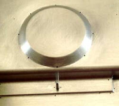 Fine vacuum holes are strategically placed to allow the soft plastic to be pulled into indentations during molding.