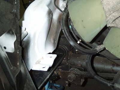 A new steering gear bracket mounted on a reinforced section of the chassis.
