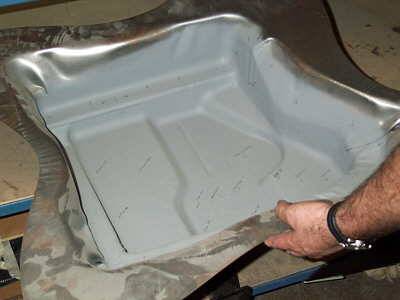 This deep-drawn panel component is part of the bulkhead conversion.  It was manufactured using low-cost stamping dies and will be laser cut to finish the edges and make penetration openings.
